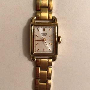 Lightly worn gold coach watch. Batteries work.